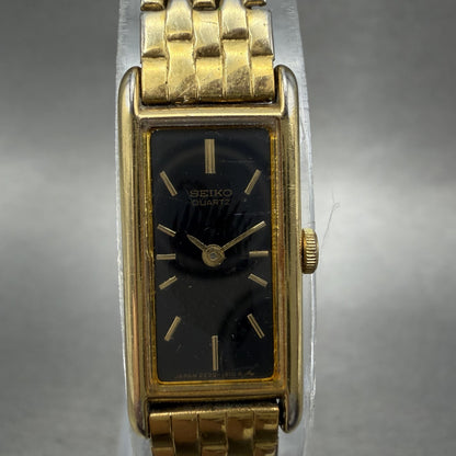 Seiko Tank Watch Women 12mm Black Dial Gold Tone Rectangle 2E20-6429 New Battery1