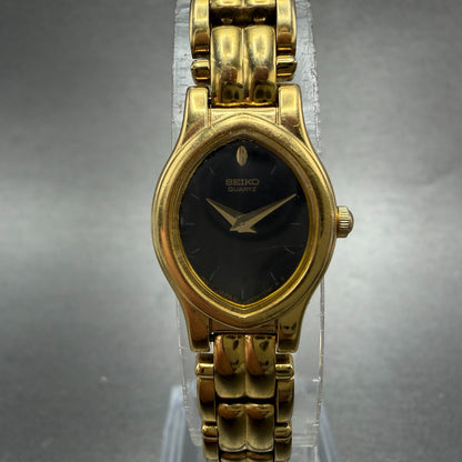 Seiko Watch Women 17mm Black Dial Gold Tone Oval V400-5588 New Battery Vintage0
