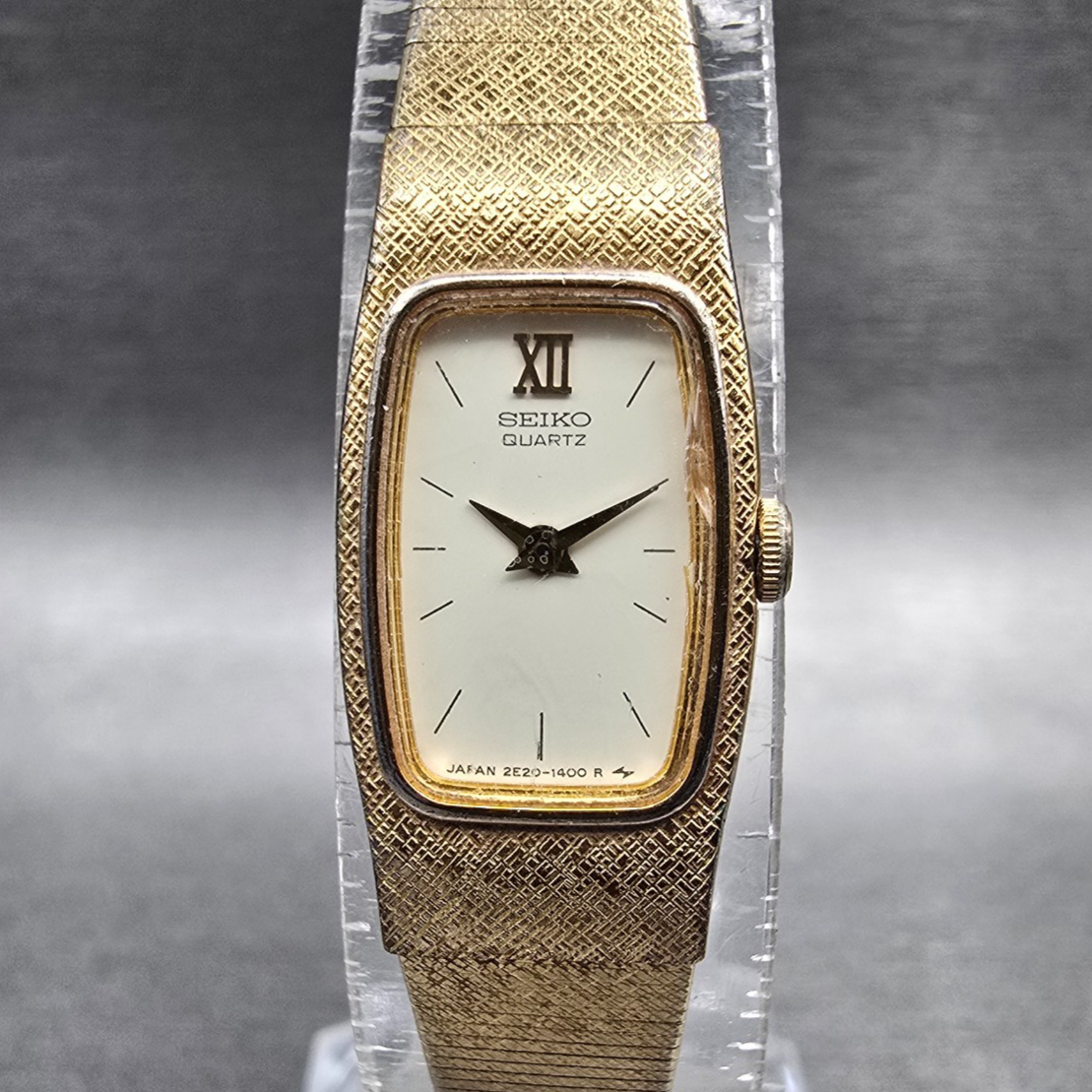 Seiko Watch Women 13mm Ivory Dial Gold Tone Rectangle 2E20-6139 New Battery0