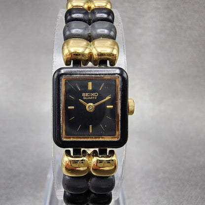 VTG Seiko Watch Women 14mm Black Dial Black Tone Rectangle 1E205540 New Battery0