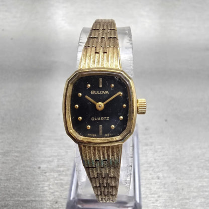 Bulova Watch Women 16mm Black Dial Gold Tone Oval 6971 New Battery Vintage0