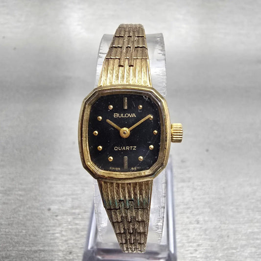 Bulova Watch Women 16mm Black Dial Gold Tone Oval 6971 New Battery Vintage0