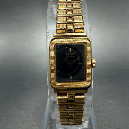 Seiko Watch Women 13mm Black Dial Gold Tone Rectangle 1E20-5689 New Battery NOS0