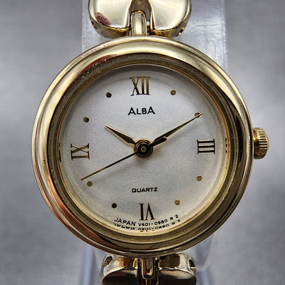 Alba Watch Women 20mm Champagne Dial Gold Tone Round Bangle V401019A New Batt1