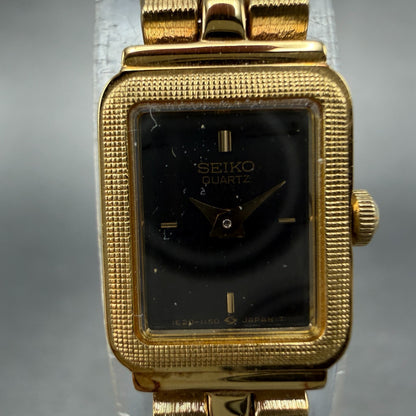 Seiko Watch Women 13mm Black Dial Gold Tone Rectangle 1E20-5689 New Battery NOS1