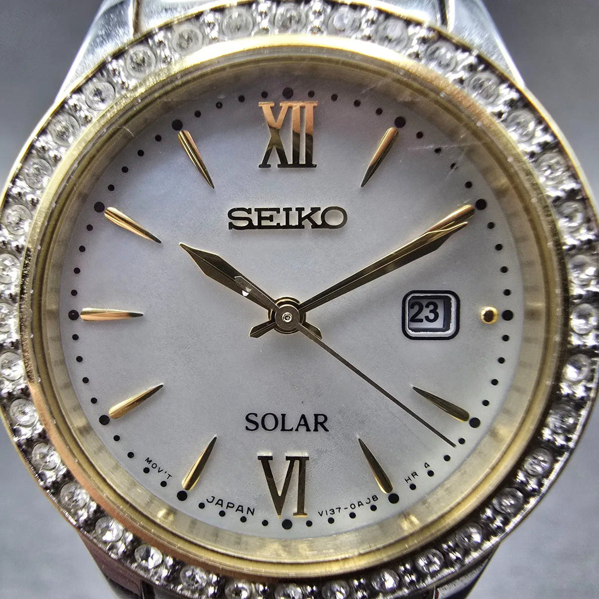 Seiko Solar Watch Women 28mm MOP Dial Two Tone Date Gemmed V137-0AA0 Works JP 951