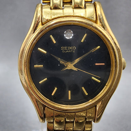 Seiko watch Women 24mm Black Dial Gold Tone Round V4011600 New Battery1