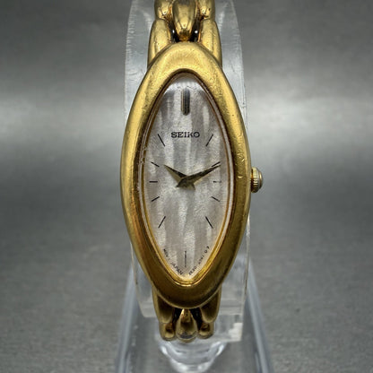 Seiko Watch Women 15mm Silver Dial Gold Tone Oval 2E207203 New Battery0