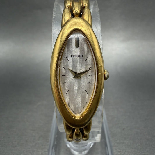 Seiko Watch Women 15mm Silver Dial Gold Tone Oval 2E207203 New Battery0