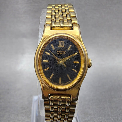 Seiko Watch Women 18mm Black Dial Gold Tone Oval V4015109 New Battery ABC1230