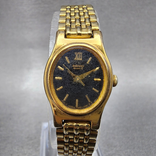 Seiko Watch Women 18mm Black Dial Gold Tone Oval V4015109 New Battery ABC1230