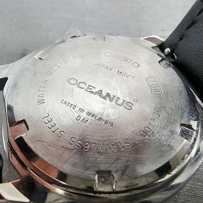 Close-up of Casio Oceanus stainless steel watch back with engraved markings