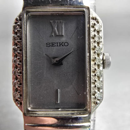 Seiko Watch Women 16mm Silver Dial Silver Tone Gemmed 1F20-0AB0 New Battery VTG1