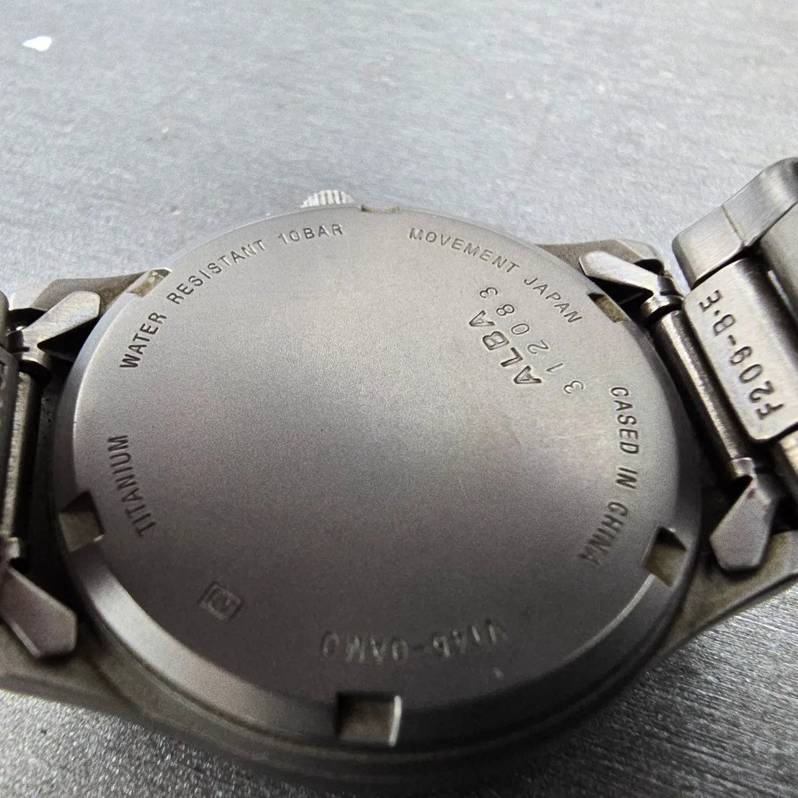 Seiko Alba Solar Watch Men 34mm White Dial Titanium Date V145-0AM0 Runs9