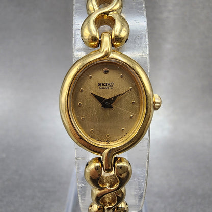 Seiko Watch Women 17mm Champagne Dial Gold Tone Oval 1n005a00 New Battery0