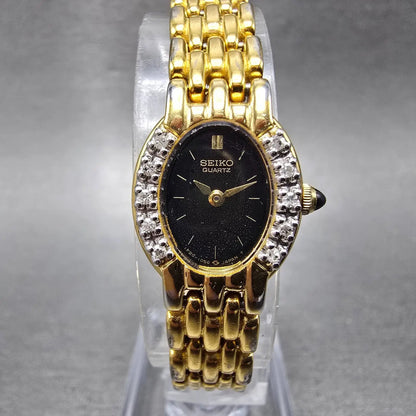 Seiko Watch Women 16mm Black Dial Gold Tone Gemmed Oval 1F20-5G19 New Battery0