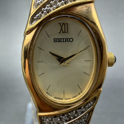 Seiko Watch Women 17mm Champagne Dial Gold Tone Oval V400-6559 VTG New Battey 561