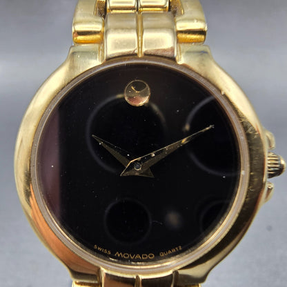 Movado Watch Women 26mm Black Dial Gold Tone Round 88-A1-844 New Battery1