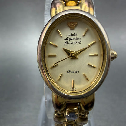 Jules Jurgenson Watch Women 17mm Champagne Dial Gold Oval Blue Gems New Battery1