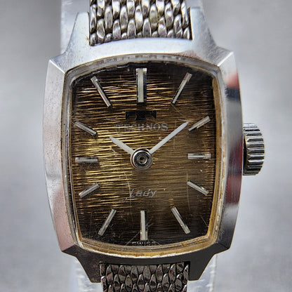Technos Tank Watch Women 16mm Gold Dial Silver Tone Rectangle Manual Wind Runs1