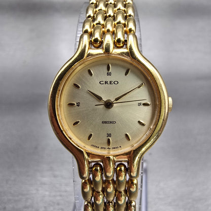 Seiko Creo Watch Women 22mm Champagne Dial Gold Tone Round 2P21-0250 New Battery0