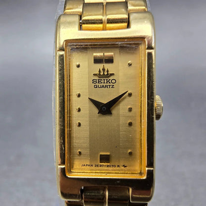 Seiko Tank Watch Women 13mm Champagne Dial Gold Tone 2E20-6590 New Battery VTG J1