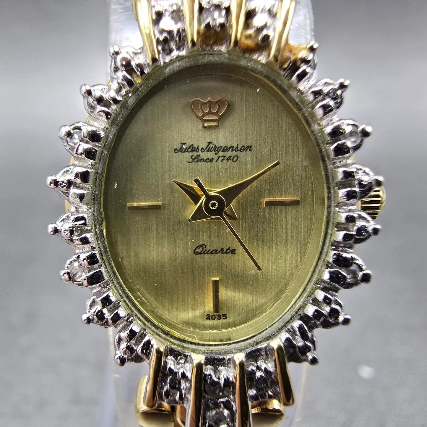 Jules Jurgenson Watch Women 17mm Champagne Dial Gold Oval Gem Set Bezel New Batt1
