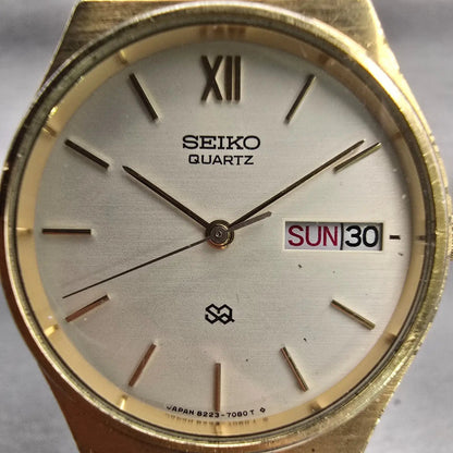 Seiko SQ Watch Men 33mm Champagne Dial Gold Tone Daydate Round 8223-7089 New Bat1