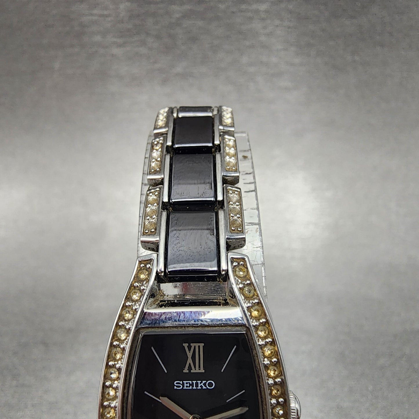 Seiko Solar Watch Women 19mm Black Dial Silver Tone Crystal Accent Runs V1150AY04