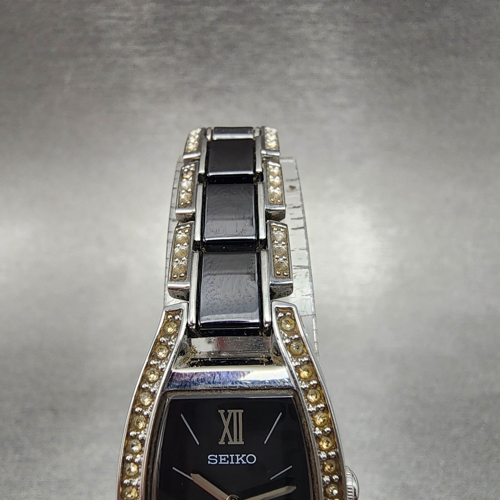 Seiko Solar Watch Women 19mm Black Dial Silver Tone Crystal Accent Runs V1150AY04