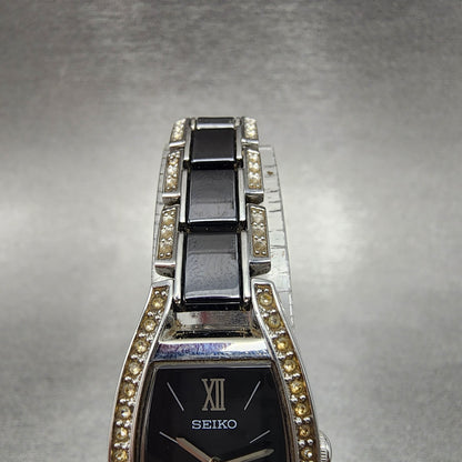 Seiko Solar Watch Women 19mm Black Dial Silver Tone Crystal Accent Runs V1150AY04