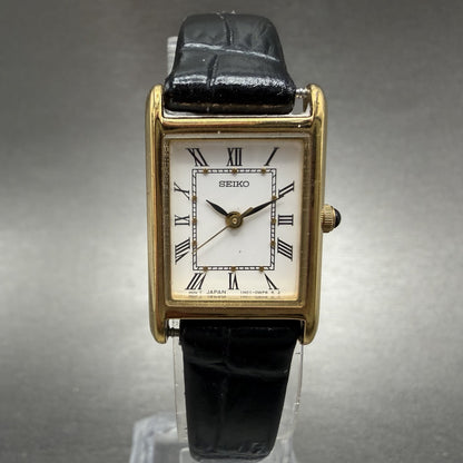 Seiko tank Watch Women 18mm White Dial Gold Tone Rectangle 1N01-0LK0 New Battery0