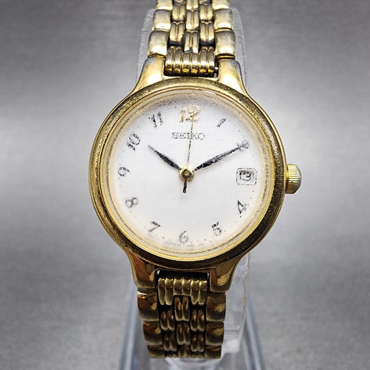 Seiko Watch Women 23mm White Dial Gold Tone Date Round 7N820228 New Battery0