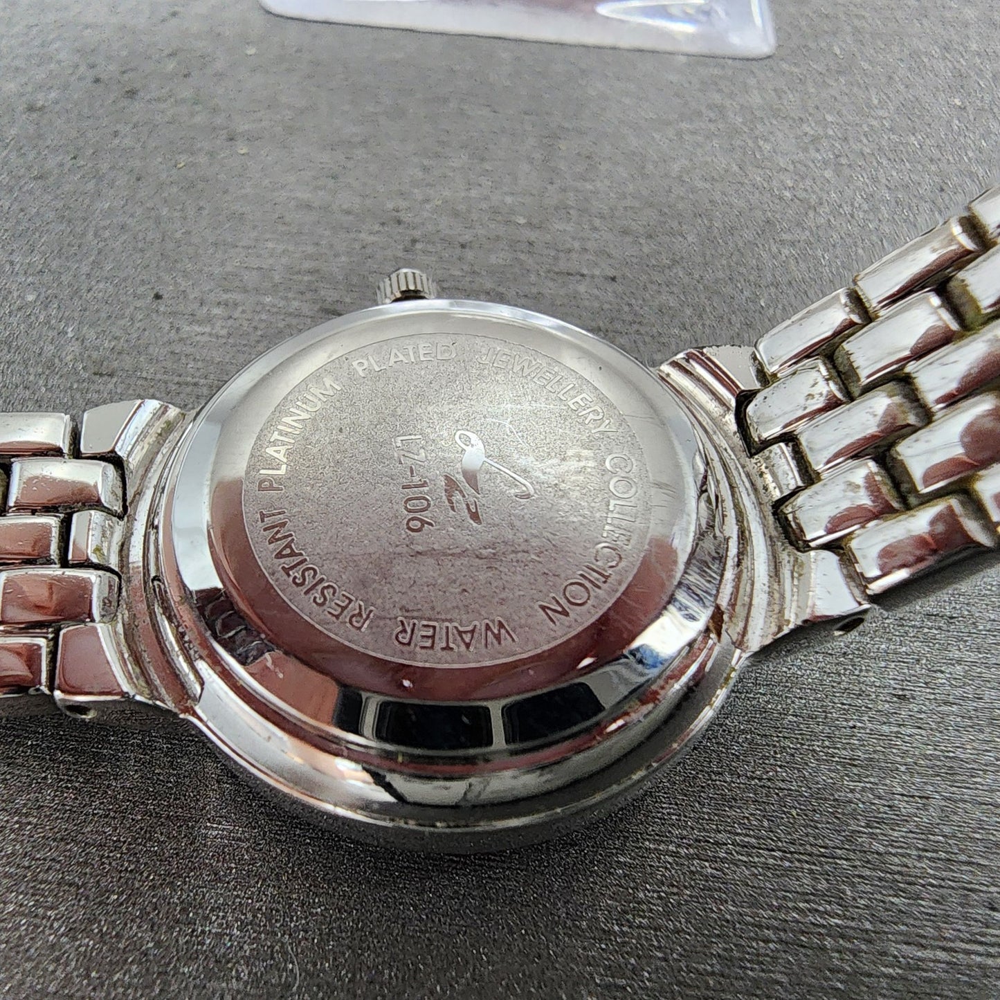 LZ Watch Women 25mm White Dial Silver Tone Ruby Bezel Diamonds Fine Plat New Bat9