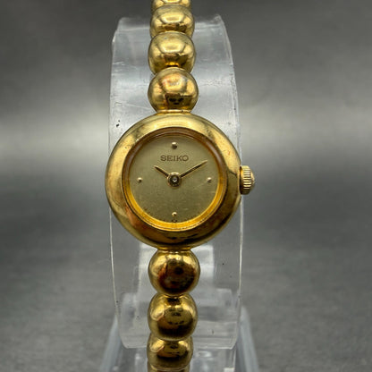 Seiko Watch Women 14mm Champagne Dial Gold Tone Round 1E20-0070 New Battery0