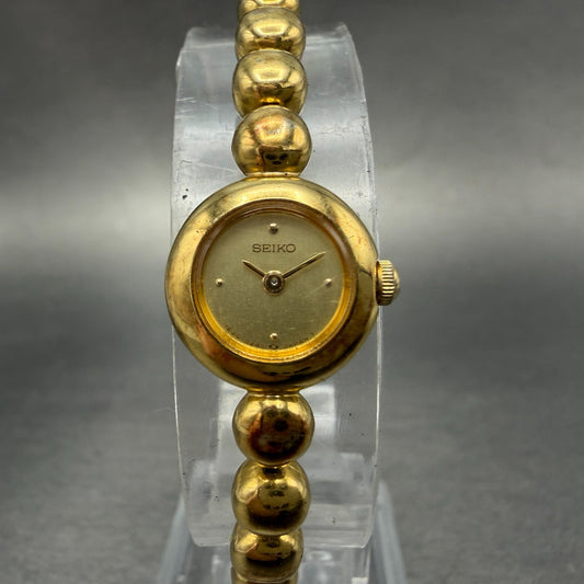Seiko Watch Women 14mm Champagne Dial Gold Tone Round 1E20-0070 New Battery0