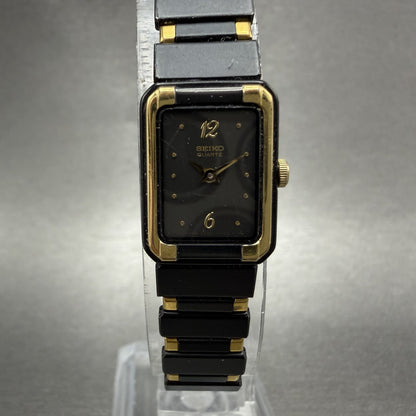 Seiko Tank Watch Women 14mm Black Dial Black & Gold Tone 2E20-5590 New Battery0