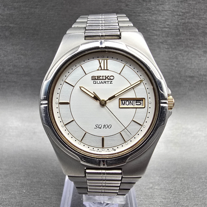 Seiko SQ 100 Watch Men 36mm Silver Dial Silver Tone Daydate 5Y23-7029 New Batt 70