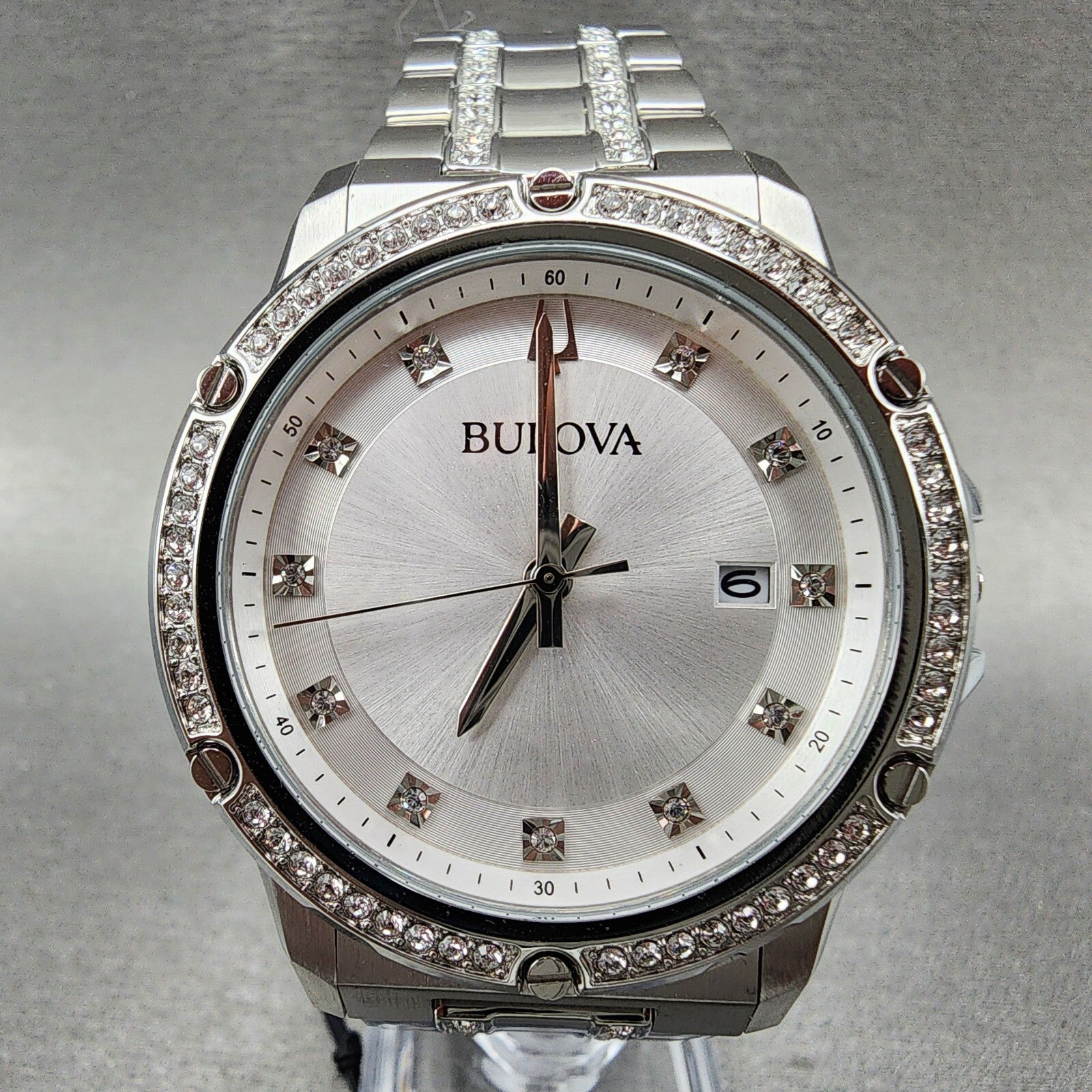 Bulova silver diamond watch with crystal accents and date display on stainless steel band