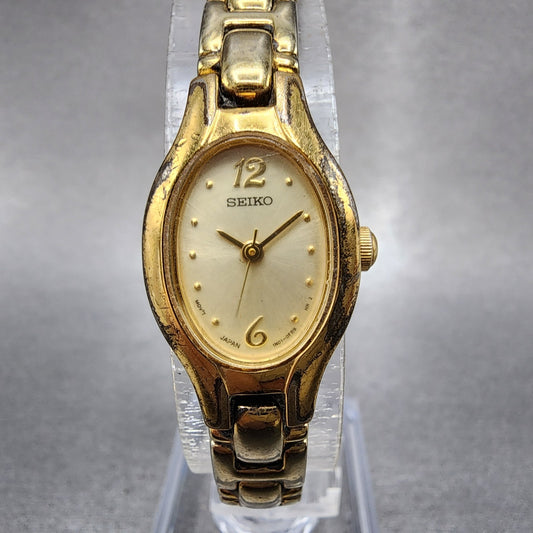 Seiko Watch Women 17mm Champagne Dial Gold Tone Oval 1N010CS0 New Battery0