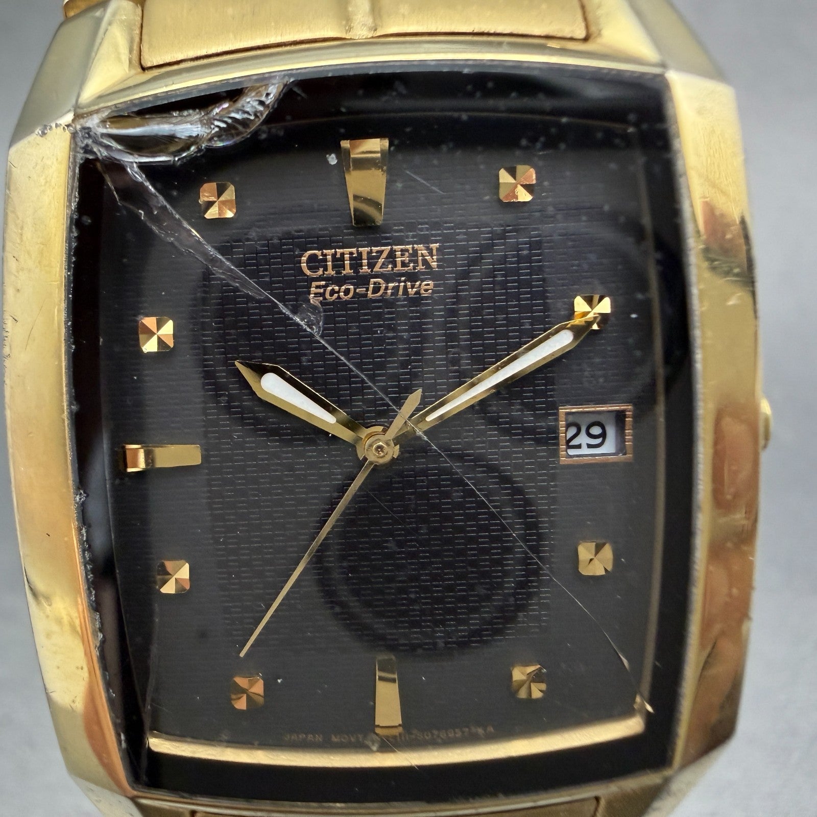 Citizen Eco-Drive Tank Watch Men 31mm Black Dial Gold Tone Date E111-S049369 Run1