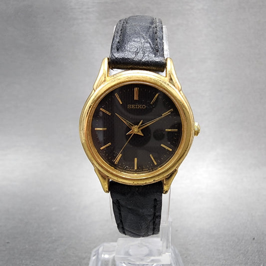 Seiko Watch Women 25mm Black Dial gold Tone Round V7011930 New Battery0