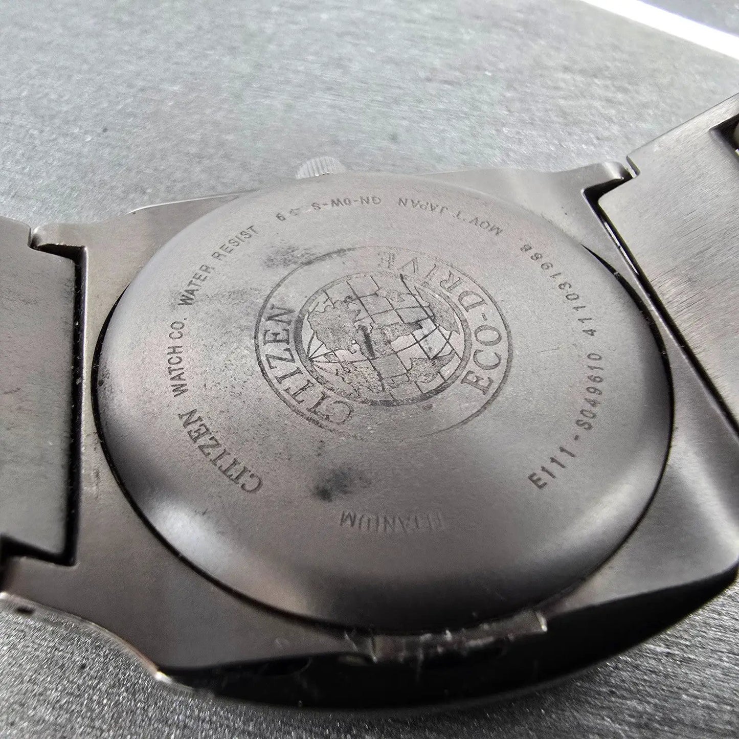 Citizen Eco-Drive Watch Men 38mm Black Dial Titanium Date E111-S049610 Runs EWR7