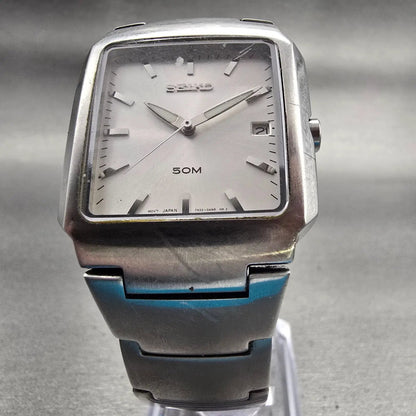 Seiko Watch Men 32mm Silver Dial Silver Tone Date Rectangle 7N32-0AL0 New Batt D5