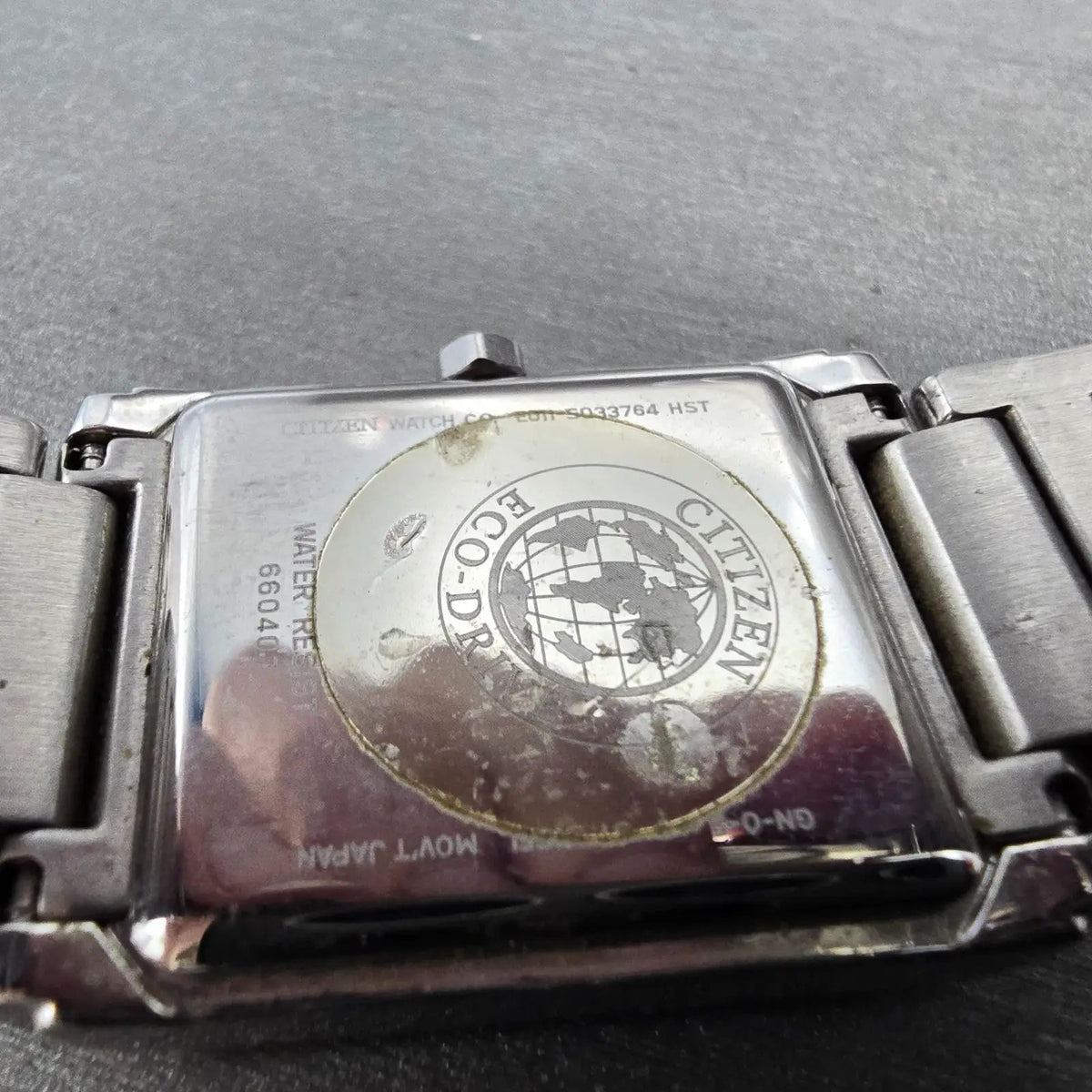 Citizen Eco-Drive Tank Watch Men 26mm White Dial Silver Date Rectangle Runs9