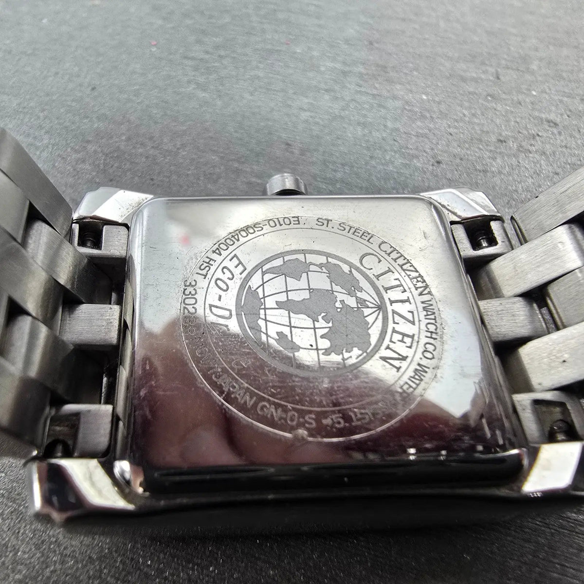 Citizen Eco-Drive Tank Watch Men 26mm Black Dial Silver Tone Date Rectangle Runs9