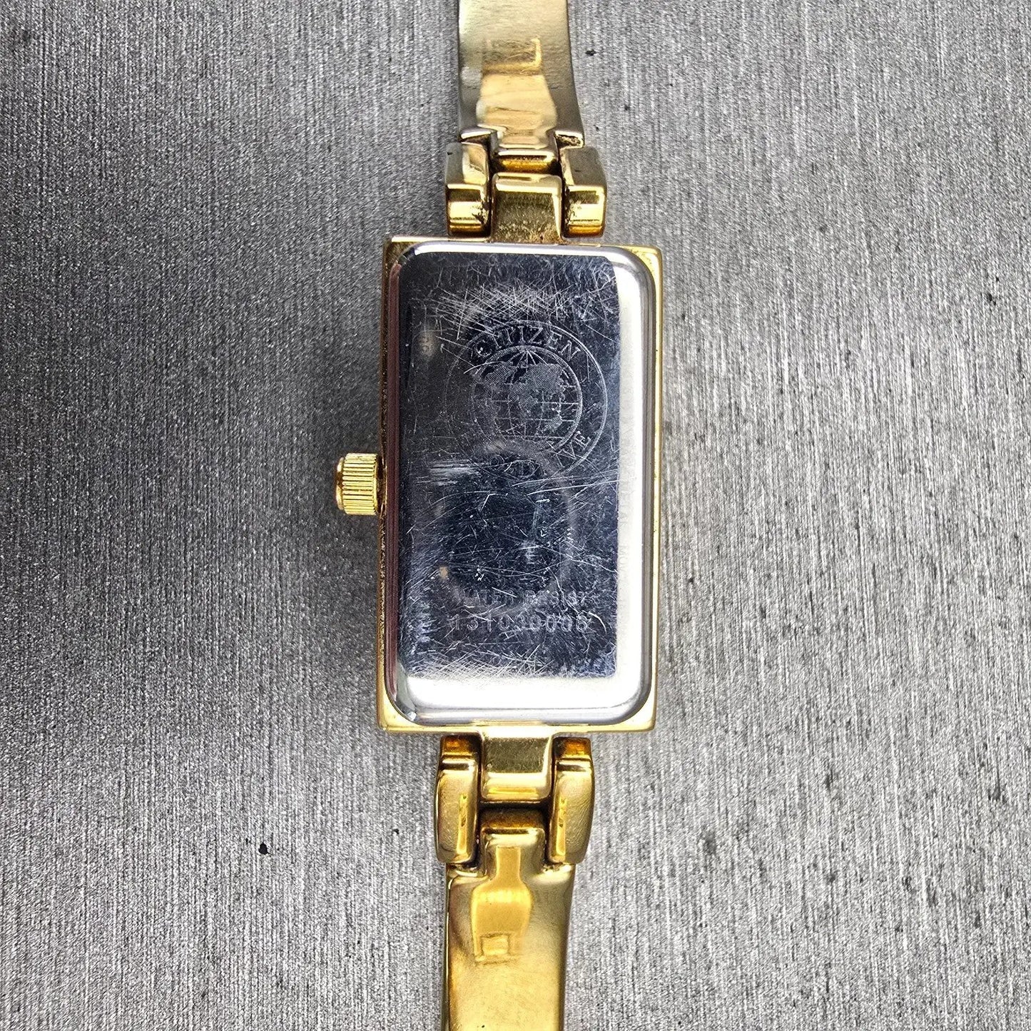 Citizen Eco-Drive Tank Watch Women 14mm White Dial Gold Tone Gemmed Bangle Works10