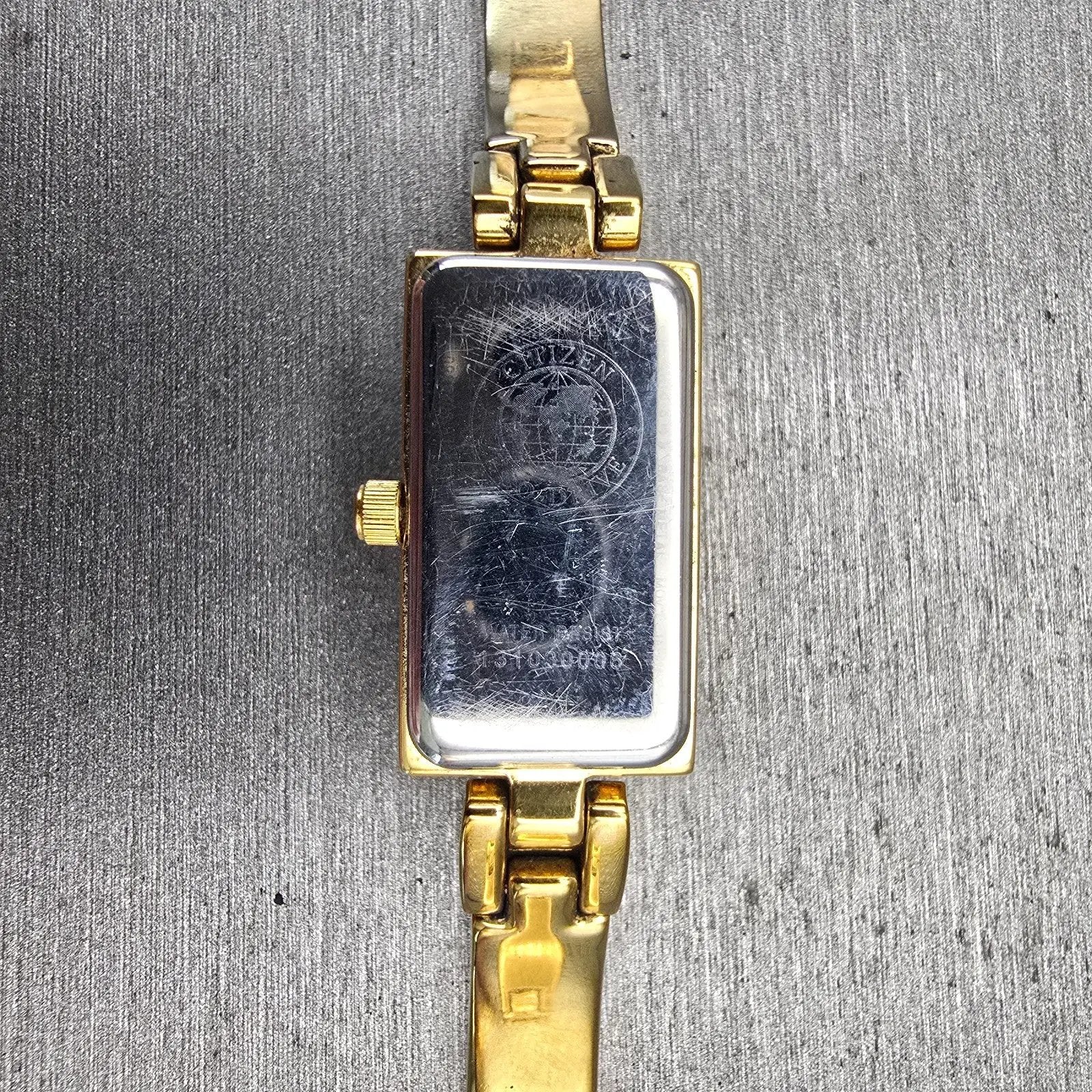Citizen Eco-Drive Tank Watch Women 14mm White Dial Gold Tone Gemmed Bangle Works10