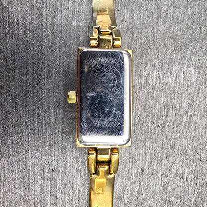 Citizen Eco-Drive Tank Watch Women 14mm White Dial Gold Tone Gemmed Bangle Works10