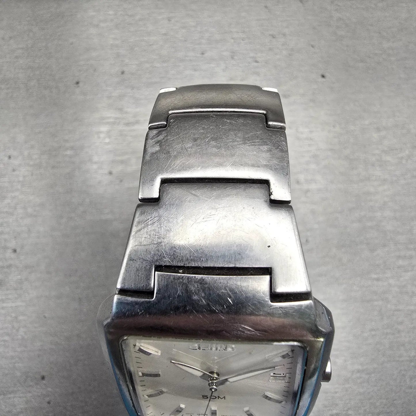 Seiko Watch Men 32mm Silver Dial Silver Tone Date Rectangle 7N32-0AL0 New Batt D4